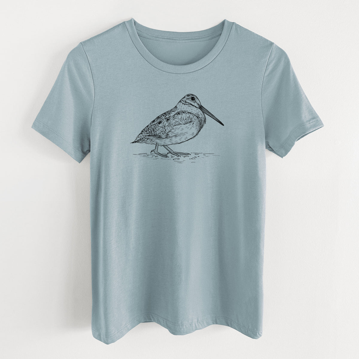 Vintage denim women's relaxed fit cotton t-shirt laid flat, printed with a detailed black ink sketch of an American woodcock standing on the ground.