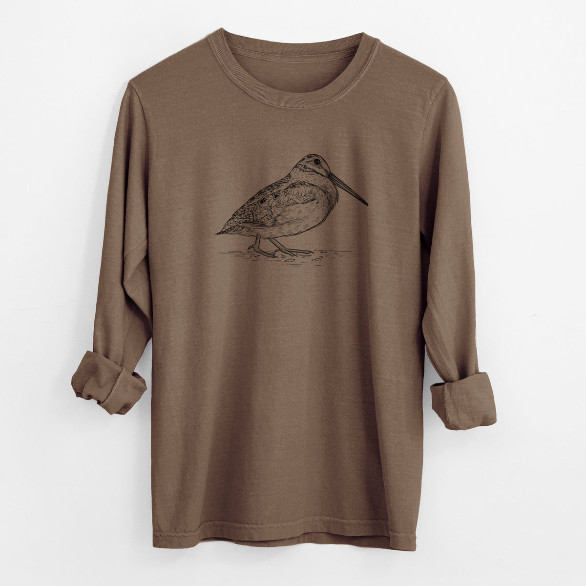 Espresso brown Comfort Colors long sleeve shirt laid flat with the cuffs rolled, printed with a detailed black ink sketch of an American woodcock standing on the ground.