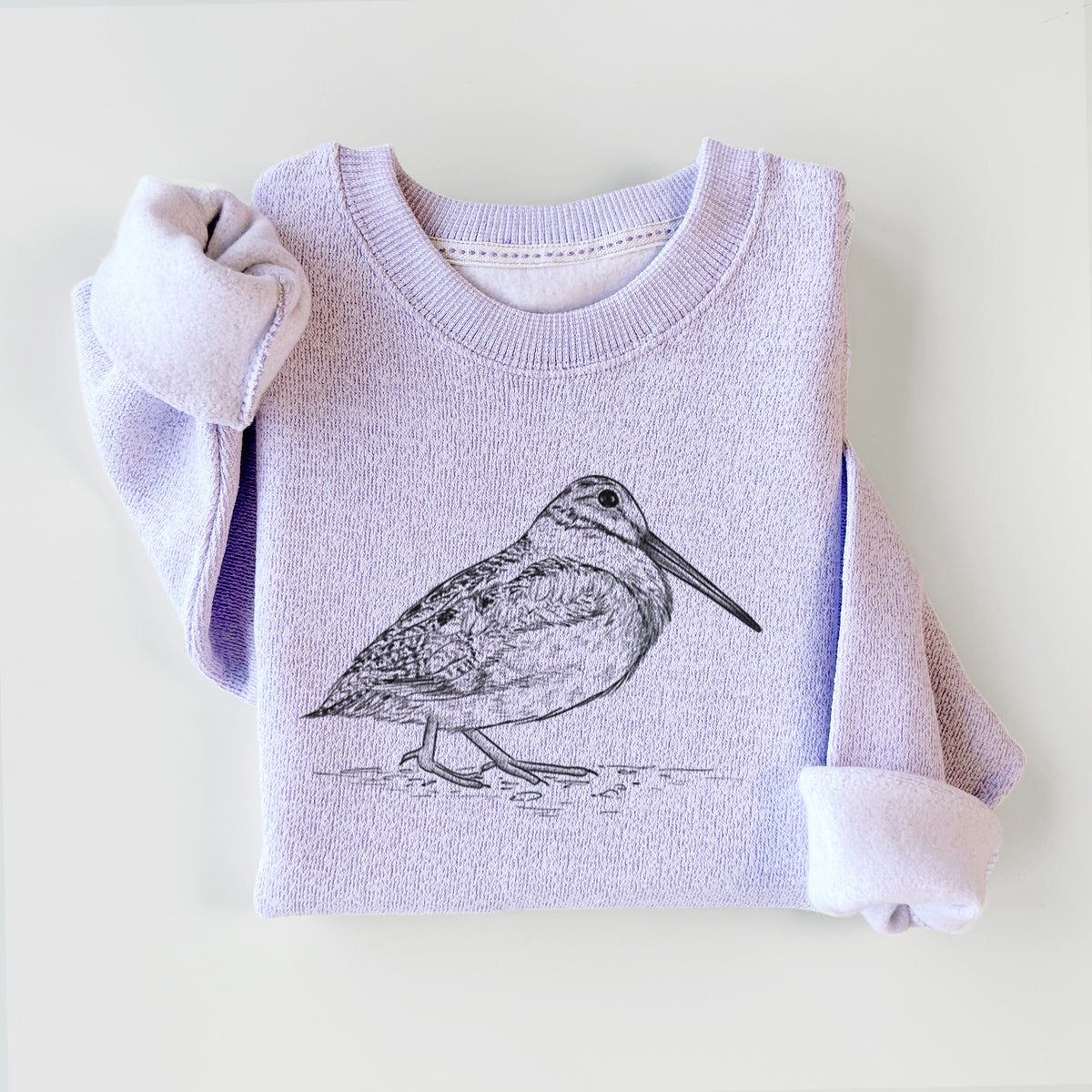 Ice purple knit sweatshirt printed with a detailed black ink sketch of an American woodcock standing on the ground, styled flat.