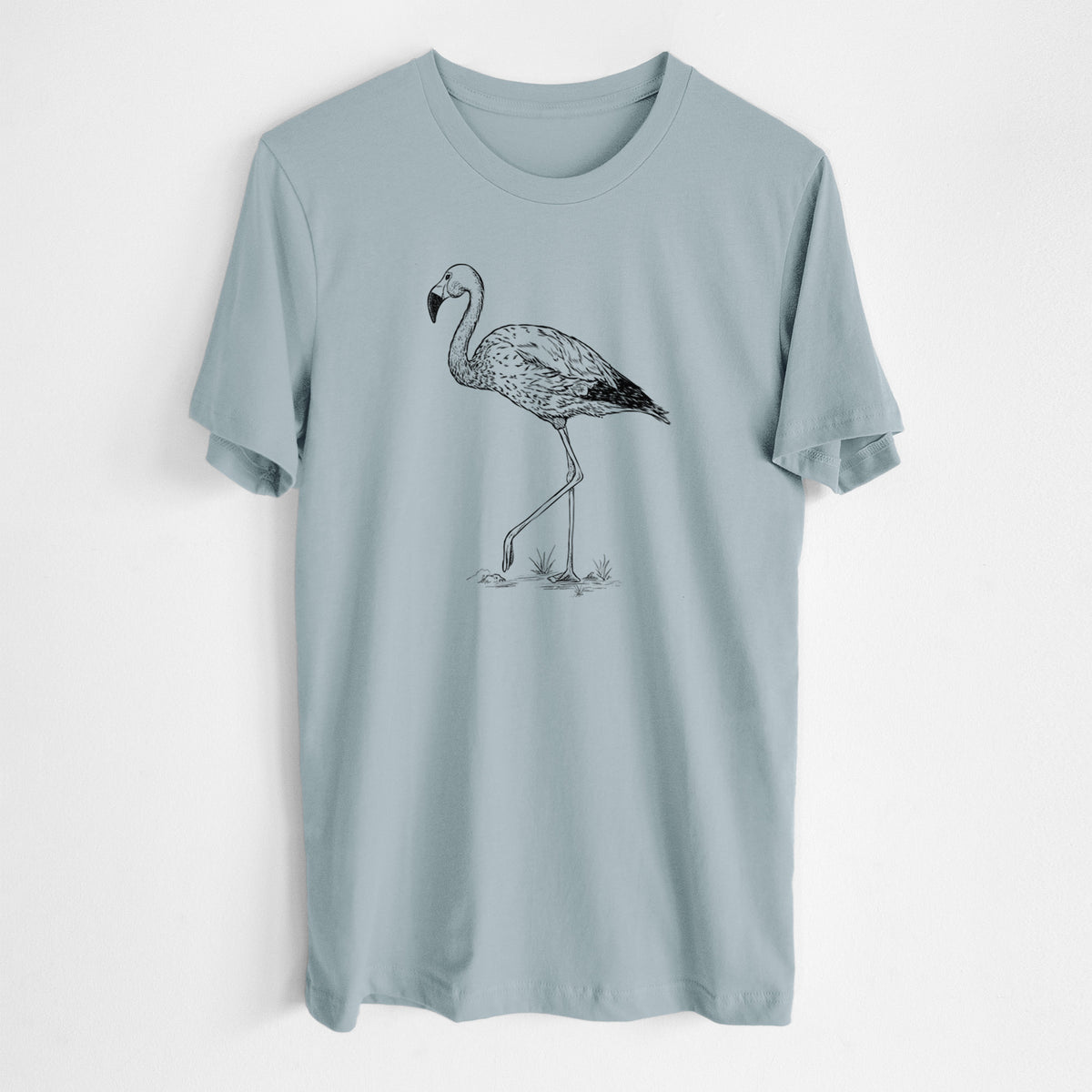 Vintage denim lightweight cotton t-shirt laid flat, printed with a black ink illustration of an Andean flamingo standing on one leg.