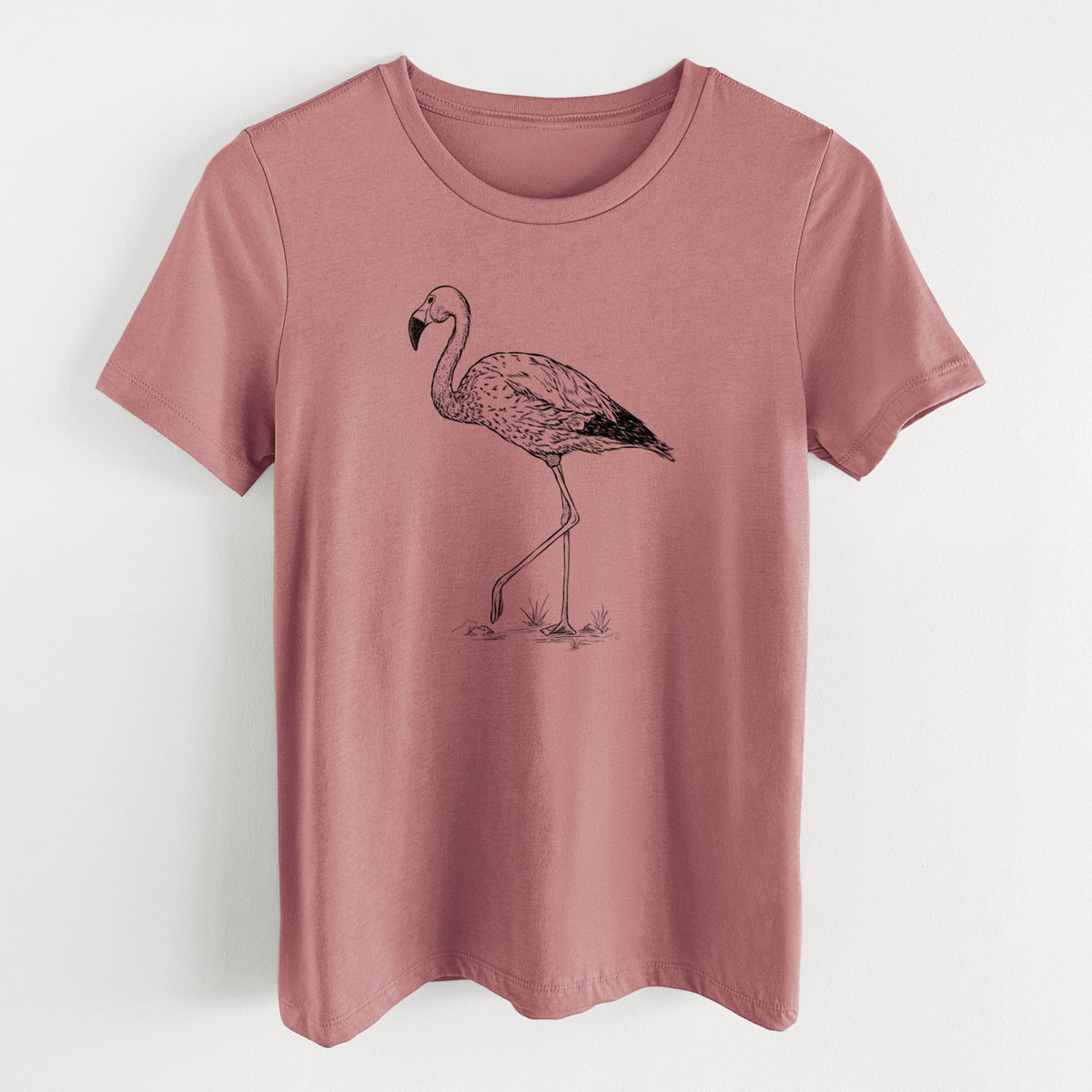 Mauve pink women's relaxed fit cotton t-shirt laid flat, printed with a black ink illustration of an Andean flamingo standing on one leg.