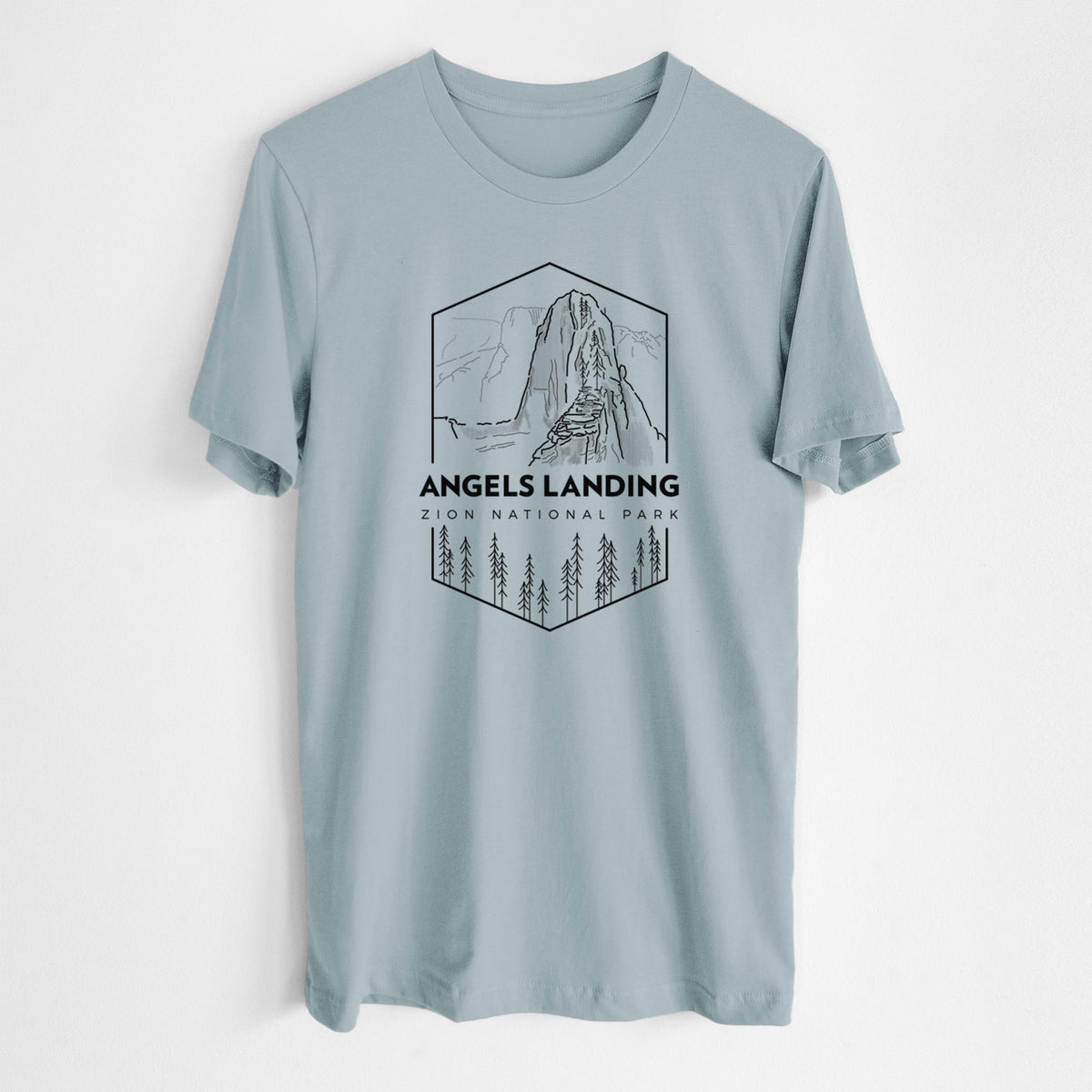 Vintage denim lightweight cotton t-shirt laid flat, printed with a black line art badge of Angels Landing above pine trees, with the words Angels Landing, Zion National Park.