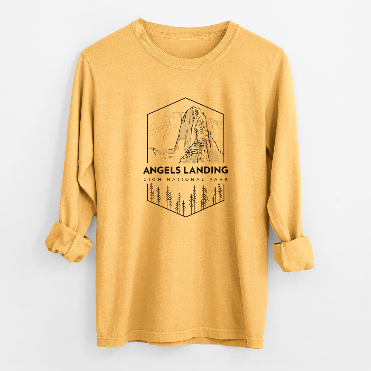 Golden wheat yellow Comfort Colors long sleeve shirt laid flat with the cuffs rolled, printed with a black line art badge of Angels Landing above pine trees, with the words Angels Landing, Zion National Park.