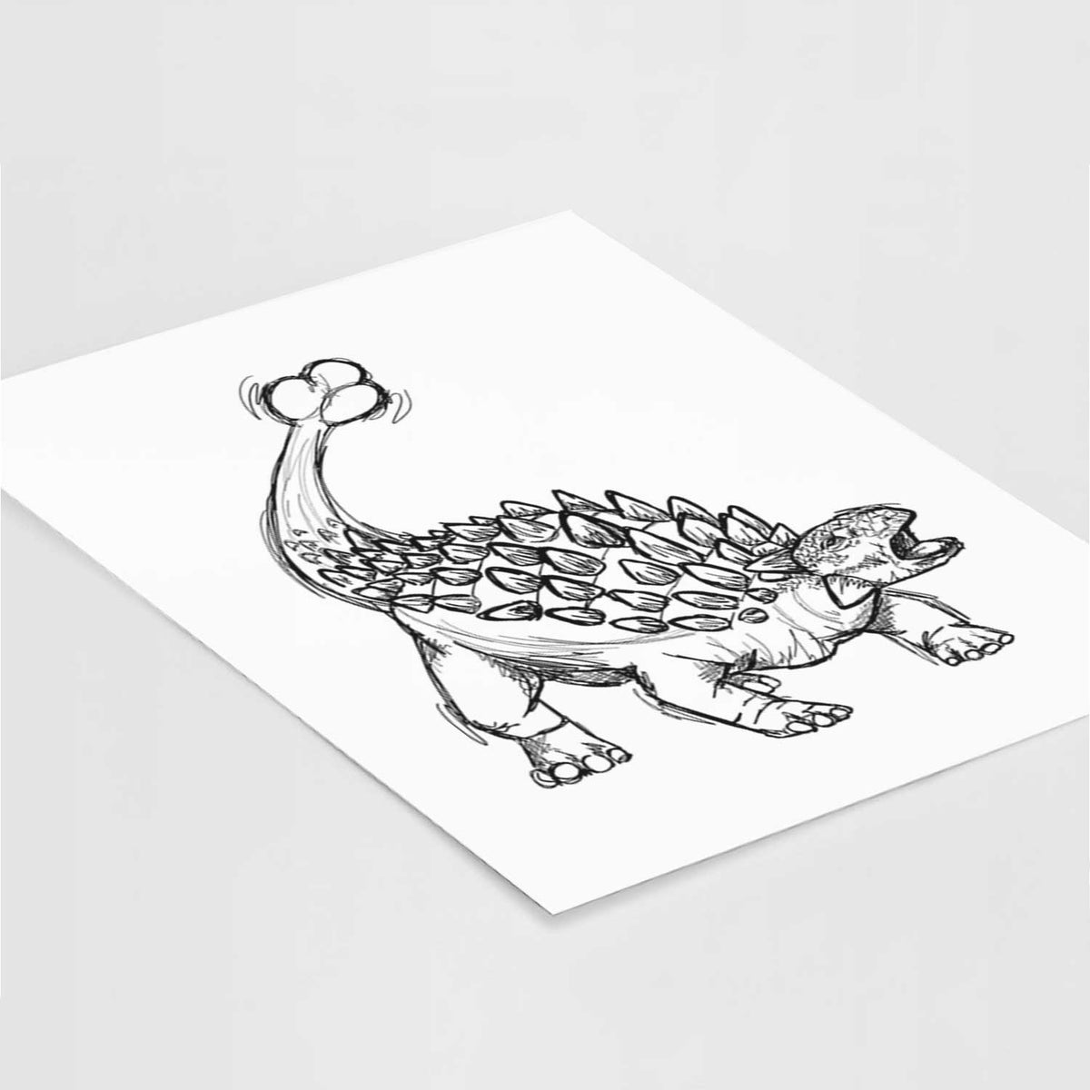 Art print of a black ink illustration of an Ankylosaurus with its club tail raised, lying at an angle on a white surface.