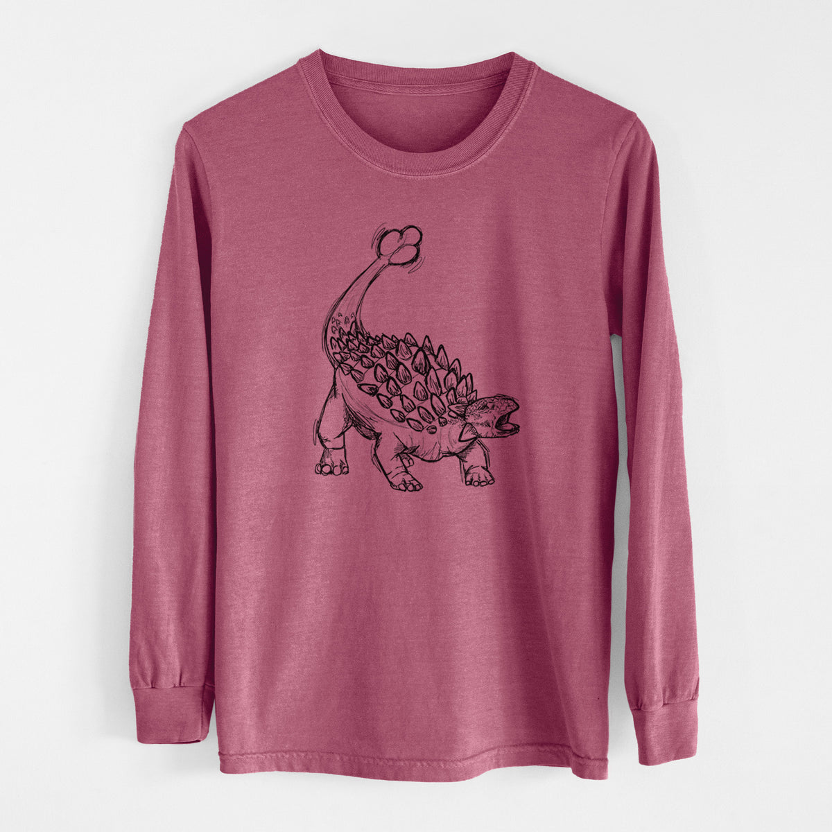 Crimson Comfort Colors long sleeve shirt laid flat, printed with a black ink illustration of an Ankylosaurus with its club tail raised.