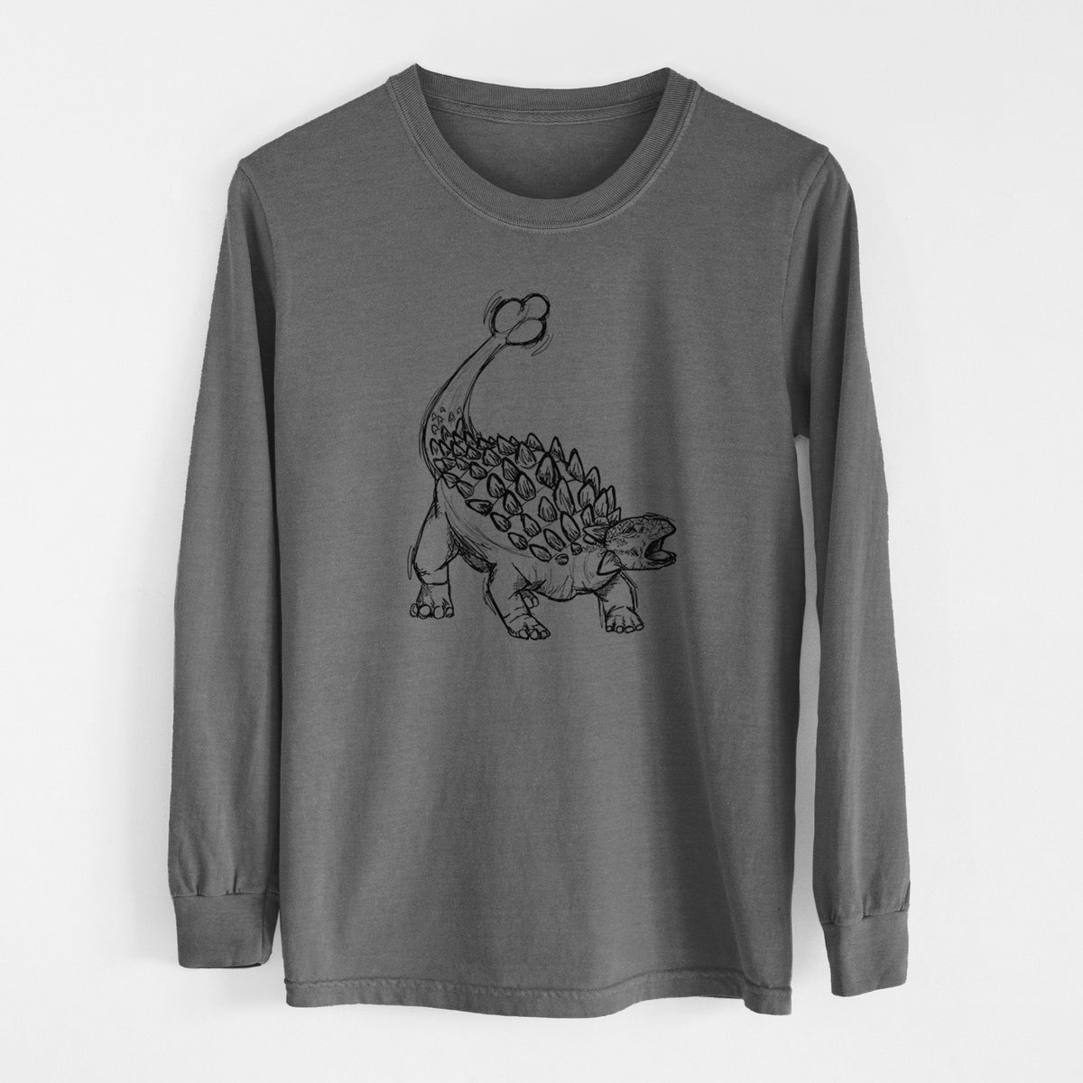 Pepper Comfort Colors long sleeve shirt laid flat, printed with a black ink illustration of an Ankylosaurus with its club tail raised.