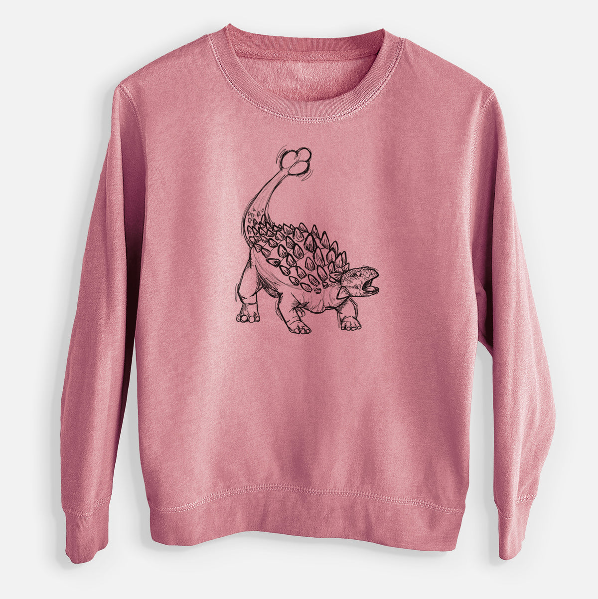 Mauve pink youth crewneck sweatshirt laid flat, printed with a black ink illustration of an Ankylosaurus with its club tail raised.