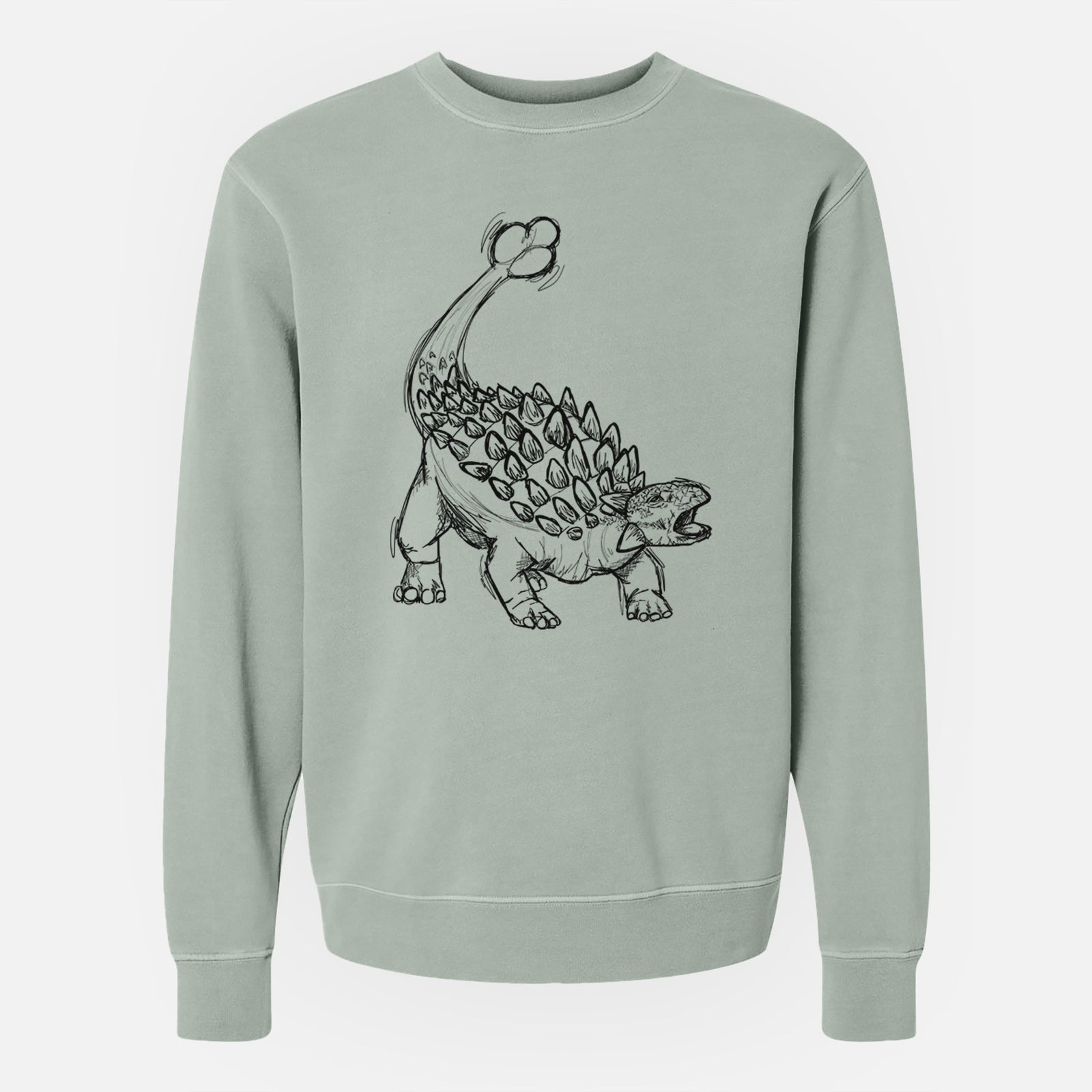 Sage green pigment dyed crewneck sweatshirt laid flat, printed with a black ink illustration of an Ankylosaurus with its club tail raised.