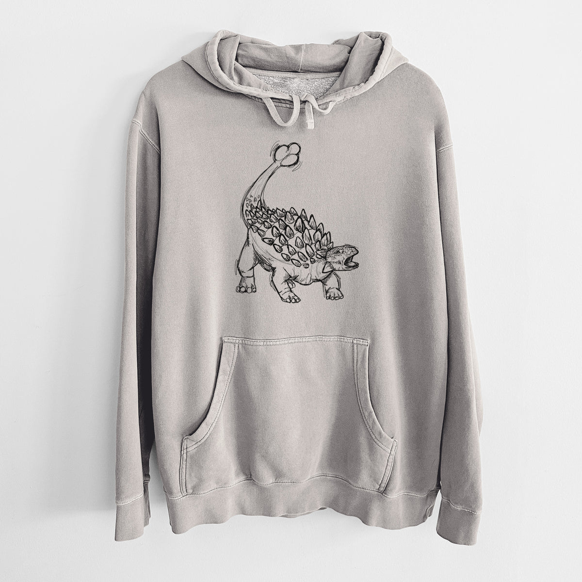 Cement grey pigment dyed hoodie laid flat, printed with a black ink illustration of an Ankylosaurus with its club tail raised.