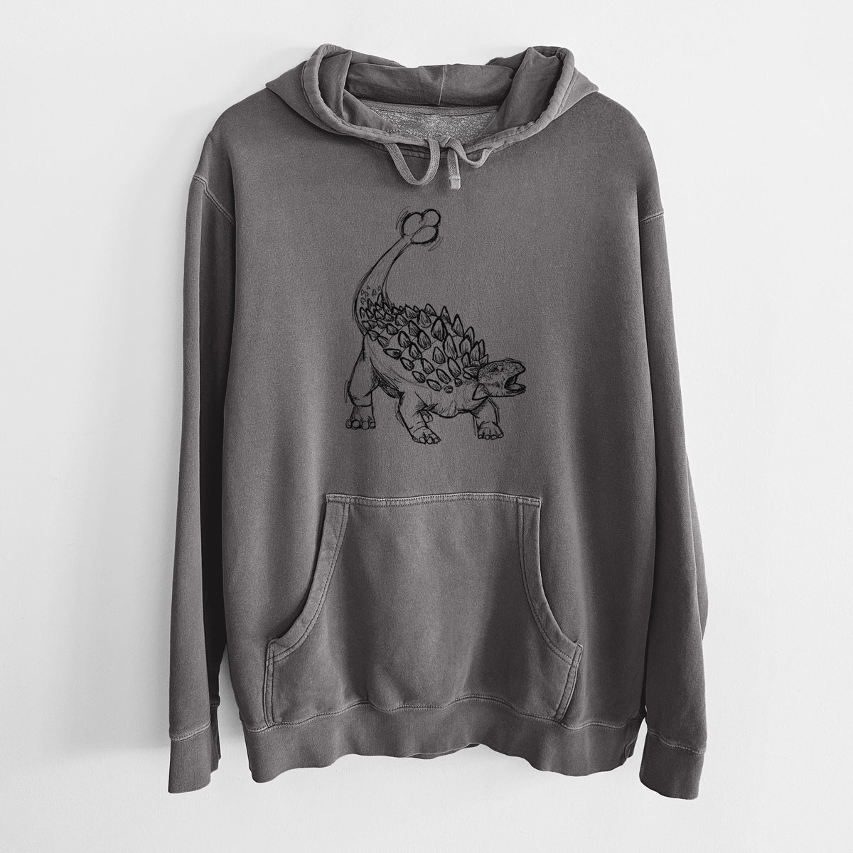 Faded black pigment dyed hoodie laid flat, printed with a black ink illustration of an Ankylosaurus with its club tail raised.