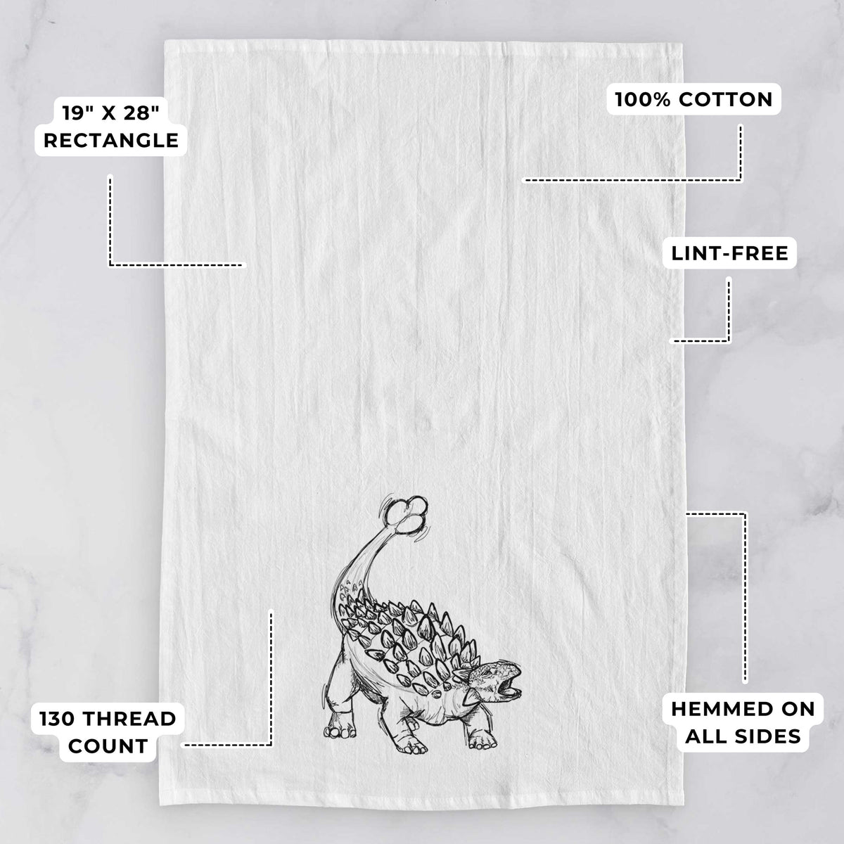 White tea towel printed with a black ink illustration of an Ankylosaurus with its club tail raised, with feature labels: 19 by 28 inch rectangle, 100% cotton, lint-free, 130 thread count, hemmed on all sides.