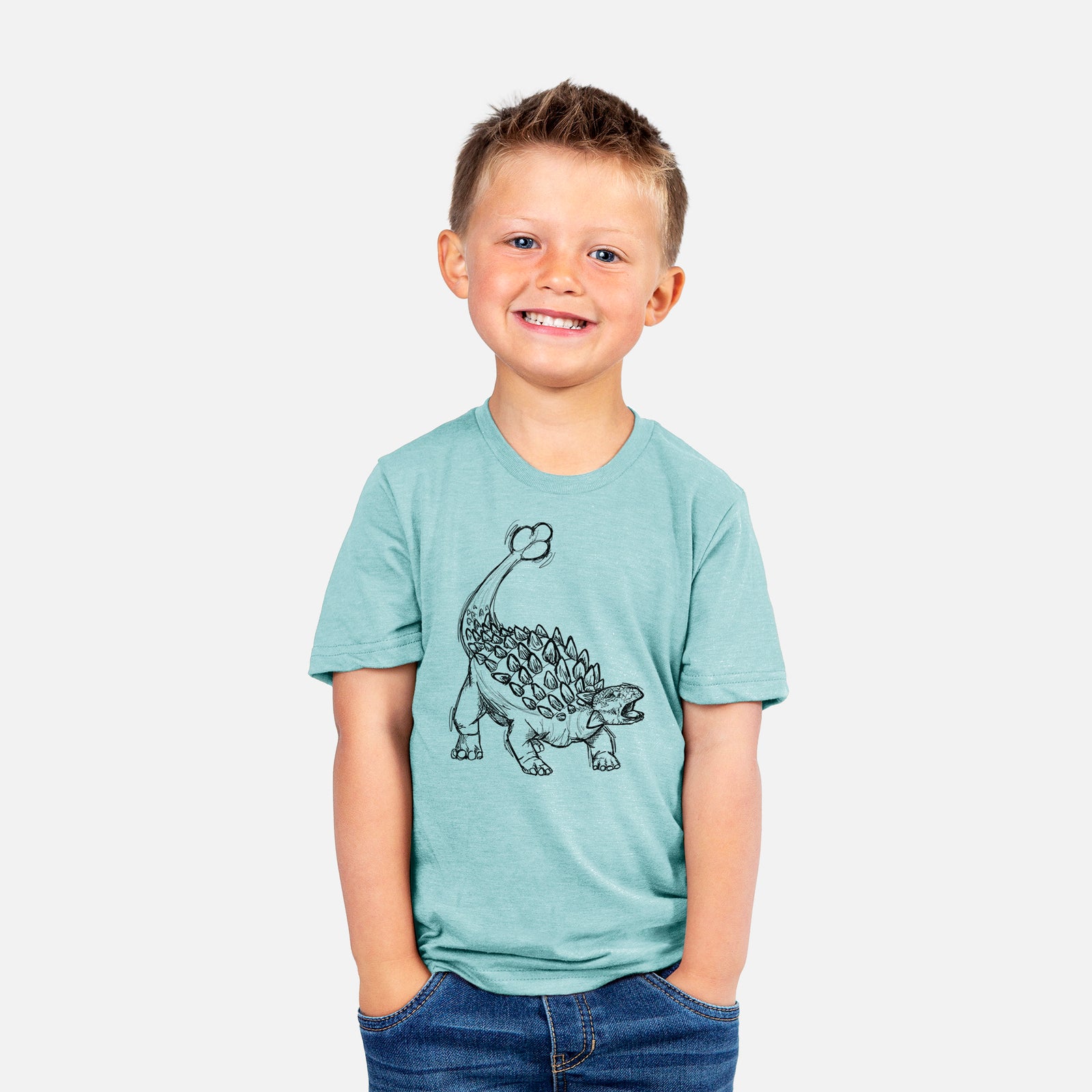 Two youth t-shirts in different colors on hangers, printed with a black ink illustration of an Ankylosaurus with its club tail raised.
