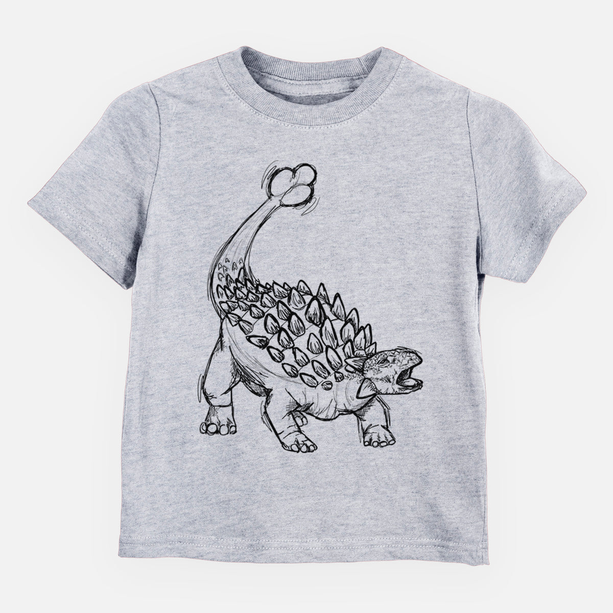 Heather grey toddler t-shirt laid flat, printed with a black ink illustration of an Ankylosaurus with its club tail raised.