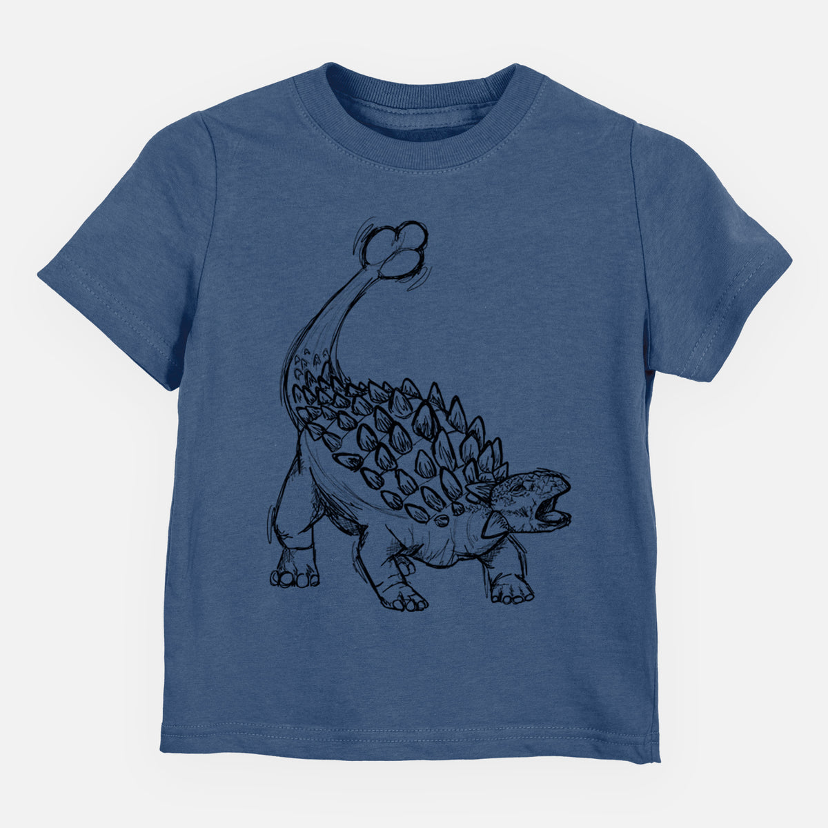 Indigo blue toddler t-shirt laid flat, printed with a black ink illustration of an Ankylosaurus with its club tail raised.