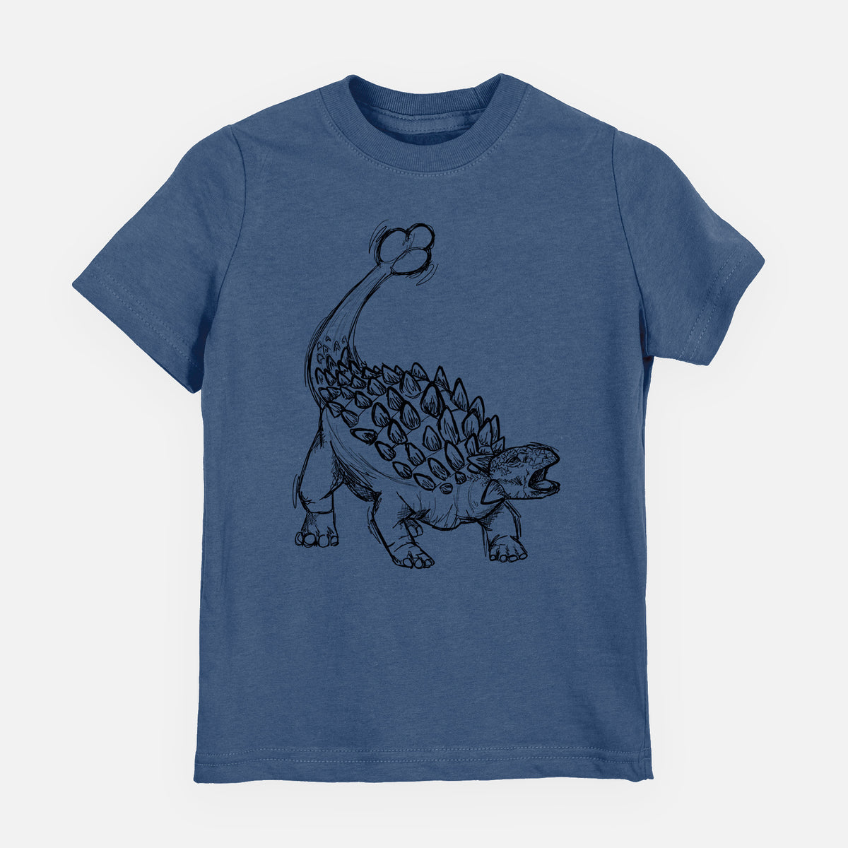 Indigo blue youth t-shirt laid flat, printed with a black ink illustration of an Ankylosaurus with its club tail raised.