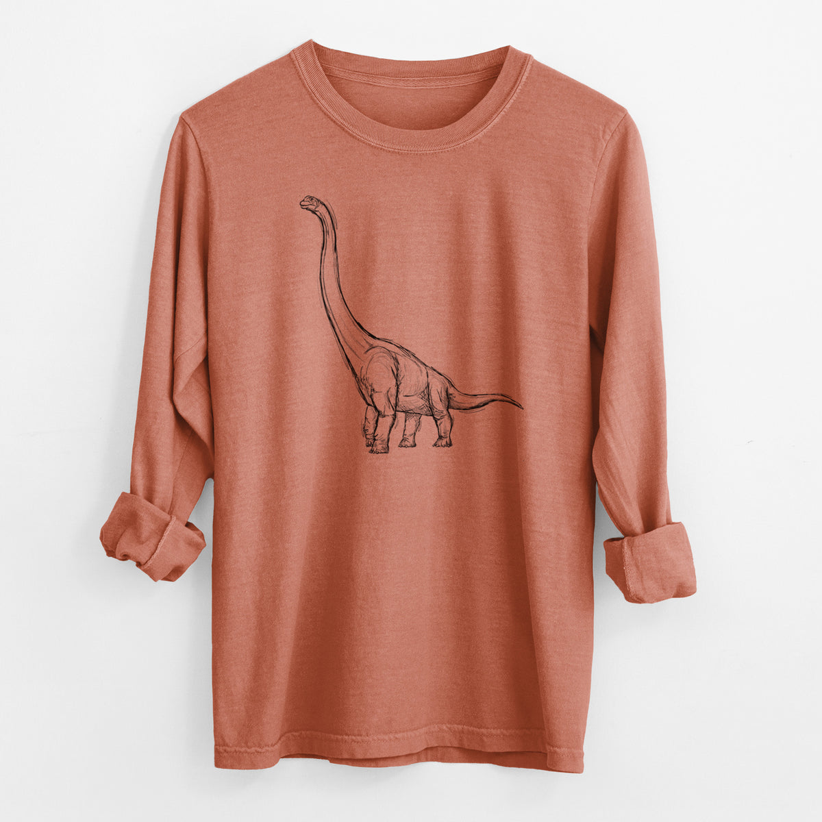 Yam burnt orange Comfort Colors long sleeve shirt laid flat with the cuffs rolled, printed with a black ink illustration of a long-necked Apatosaurus walking.