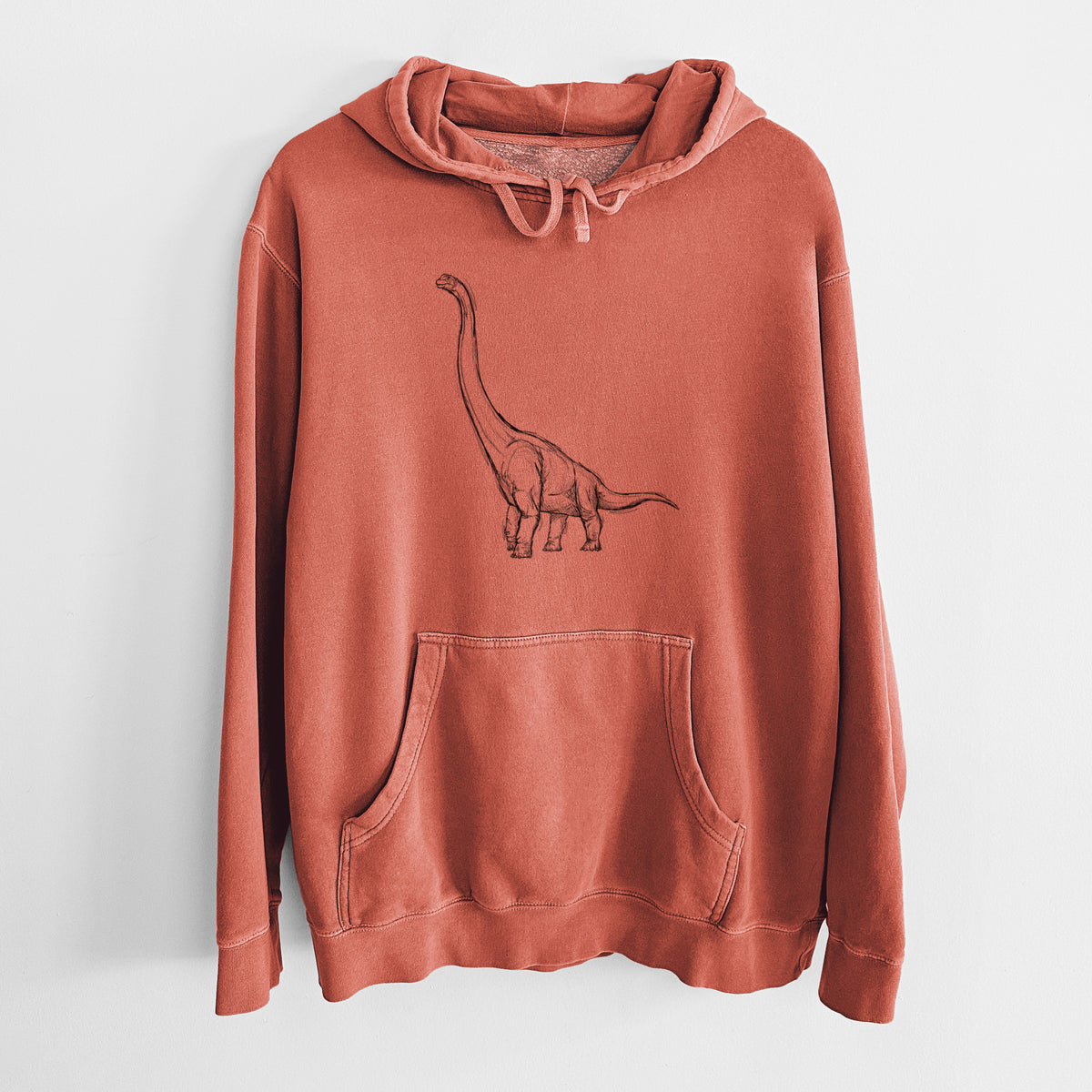 Amber orange pigment dyed hoodie laid flat, printed with a black ink illustration of a long-necked Apatosaurus walking.