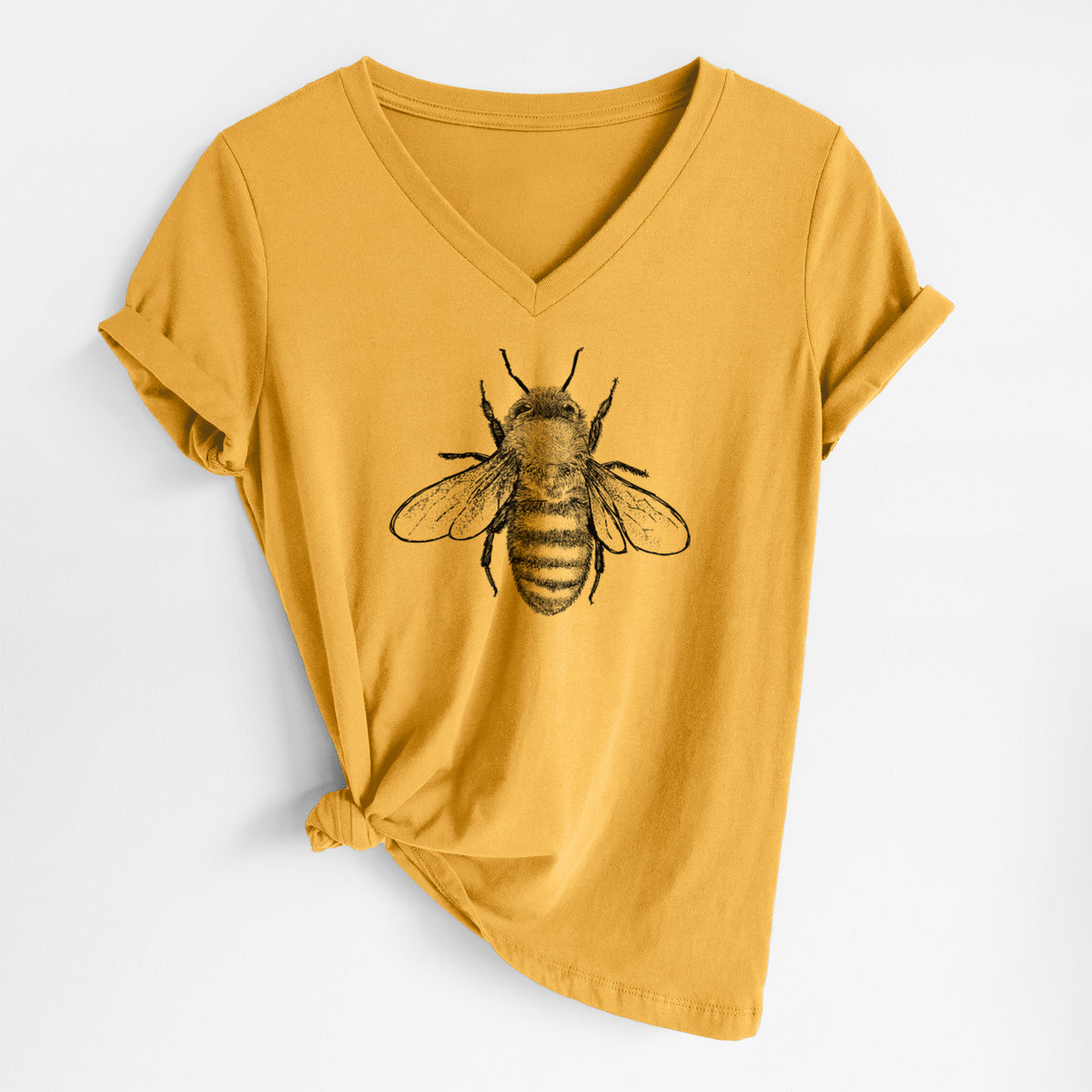 Honeycomb yellow women's relaxed fit cotton V-neck t-shirt laid flat, printed with a detailed black ink illustration of a honey bee with its wings spread, seen from above.