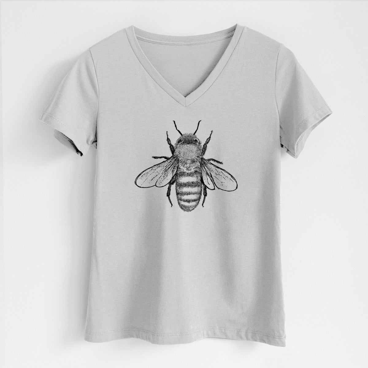 Lunar grey women's relaxed fit cotton V-neck t-shirt laid flat, printed with a detailed black ink illustration of a honey bee with its wings spread, seen from above.