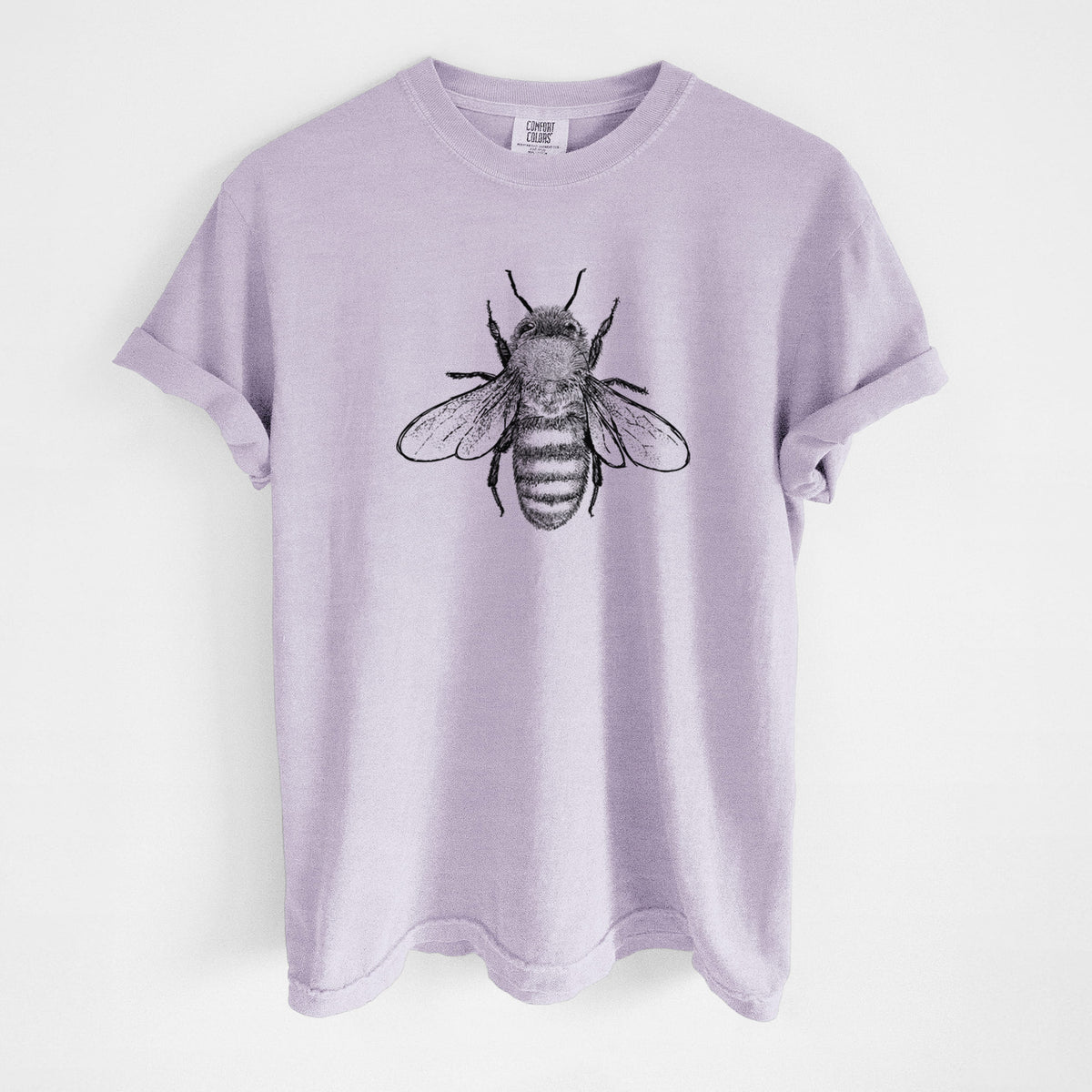 Orchid purple Comfort Colors t-shirt laid flat, printed with a detailed black ink illustration of a honey bee with its wings spread, seen from above.