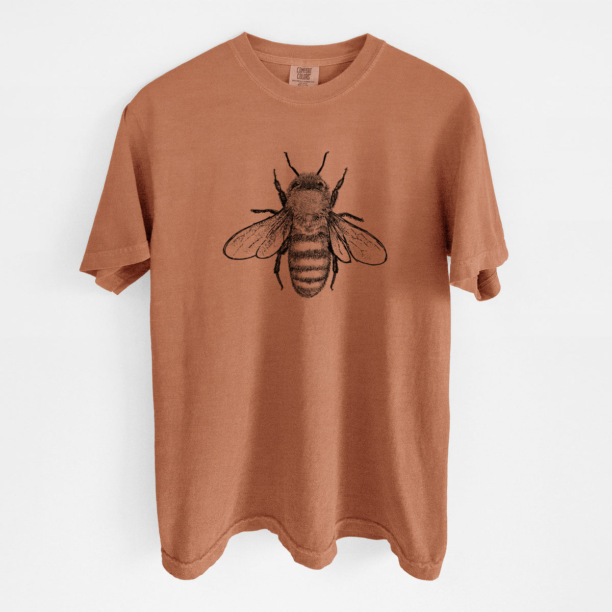 Yam burnt orange Comfort Colors t-shirt laid flat, printed with a detailed black ink illustration of a honey bee with its wings spread, seen from above.