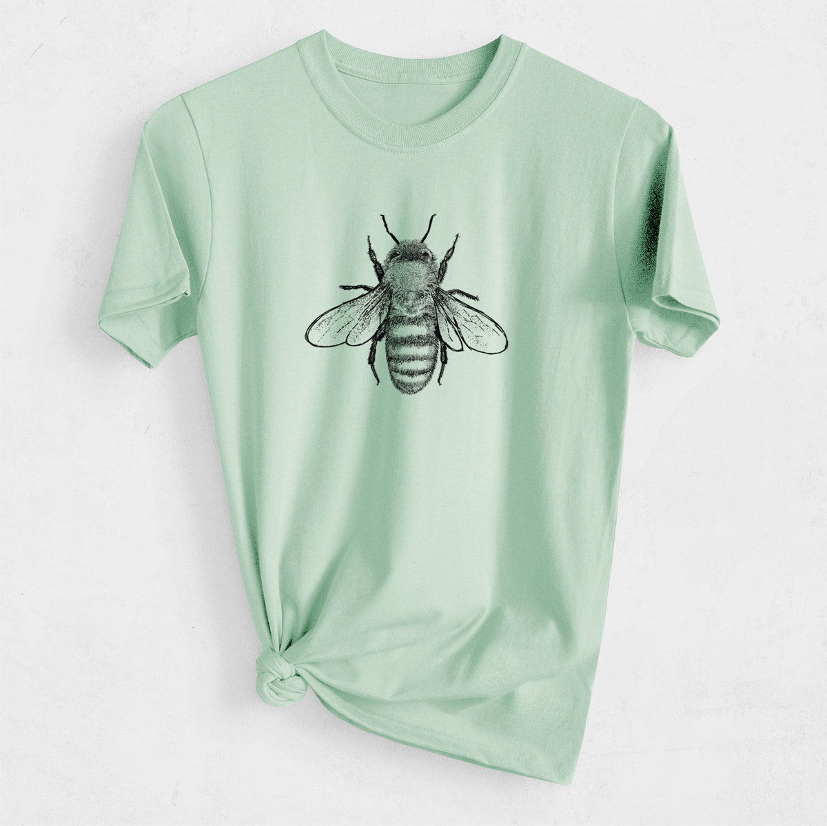 Sunwashed mint organic cotton t-shirt printed with a detailed black ink illustration of a honey bee with its wings spread, seen from above.