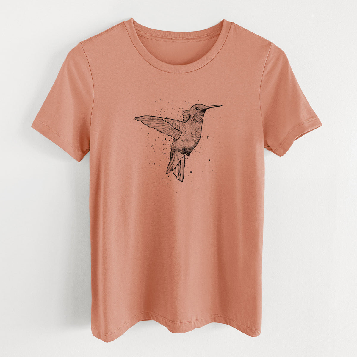 Terracotta orange women's relaxed fit cotton t-shirt laid flat, printed with a black ink sketch of a ruby-throated hummingbird hovering with its wings raised.