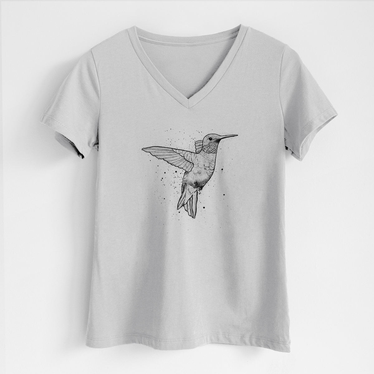 Lunar grey women's relaxed fit cotton V-neck t-shirt laid flat, printed with a black ink sketch of a ruby-throated hummingbird hovering with its wings raised.