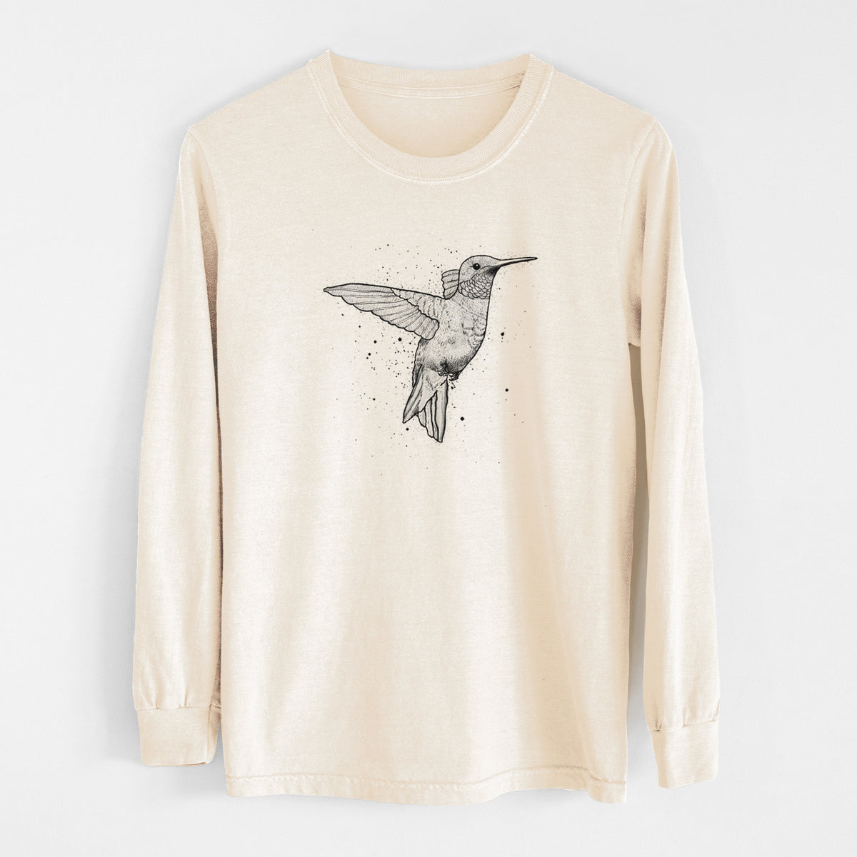 Ivory Comfort Colors long sleeve shirt laid flat, printed with a black ink sketch of a ruby-throated hummingbird hovering with its wings raised.