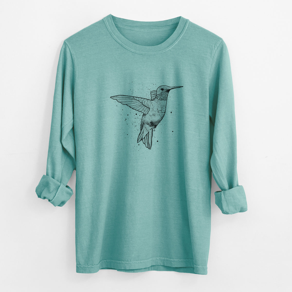 Reef green Comfort Colors long sleeve shirt laid flat with the cuffs rolled, printed with a black ink sketch of a ruby-throated hummingbird hovering with its wings raised.