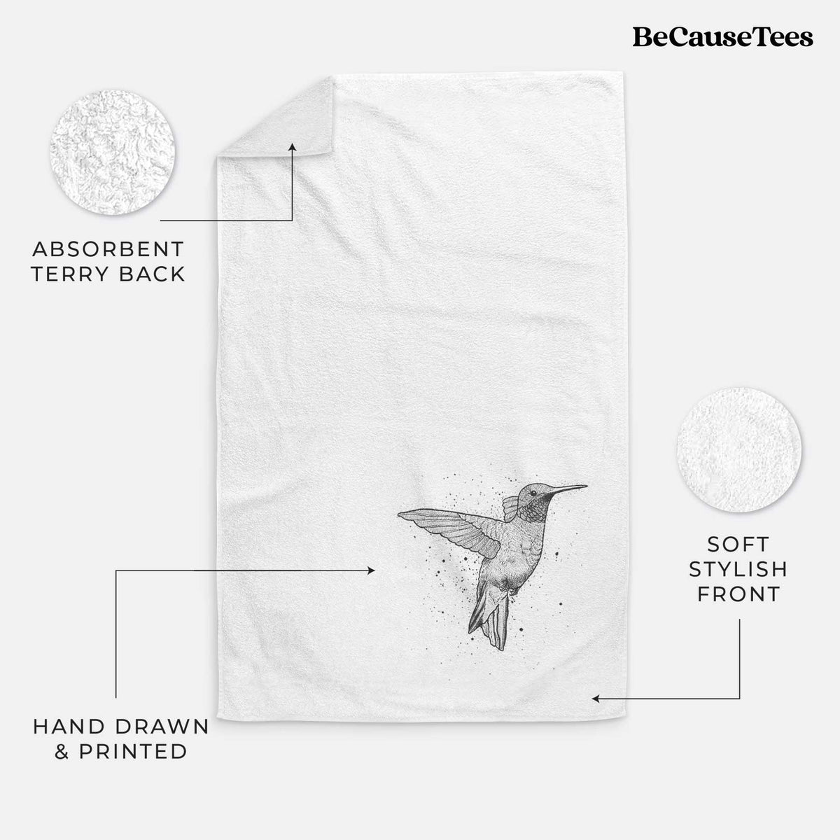 White hand towel printed with a black ink sketch of a ruby-throated hummingbird hovering with its wings raised.