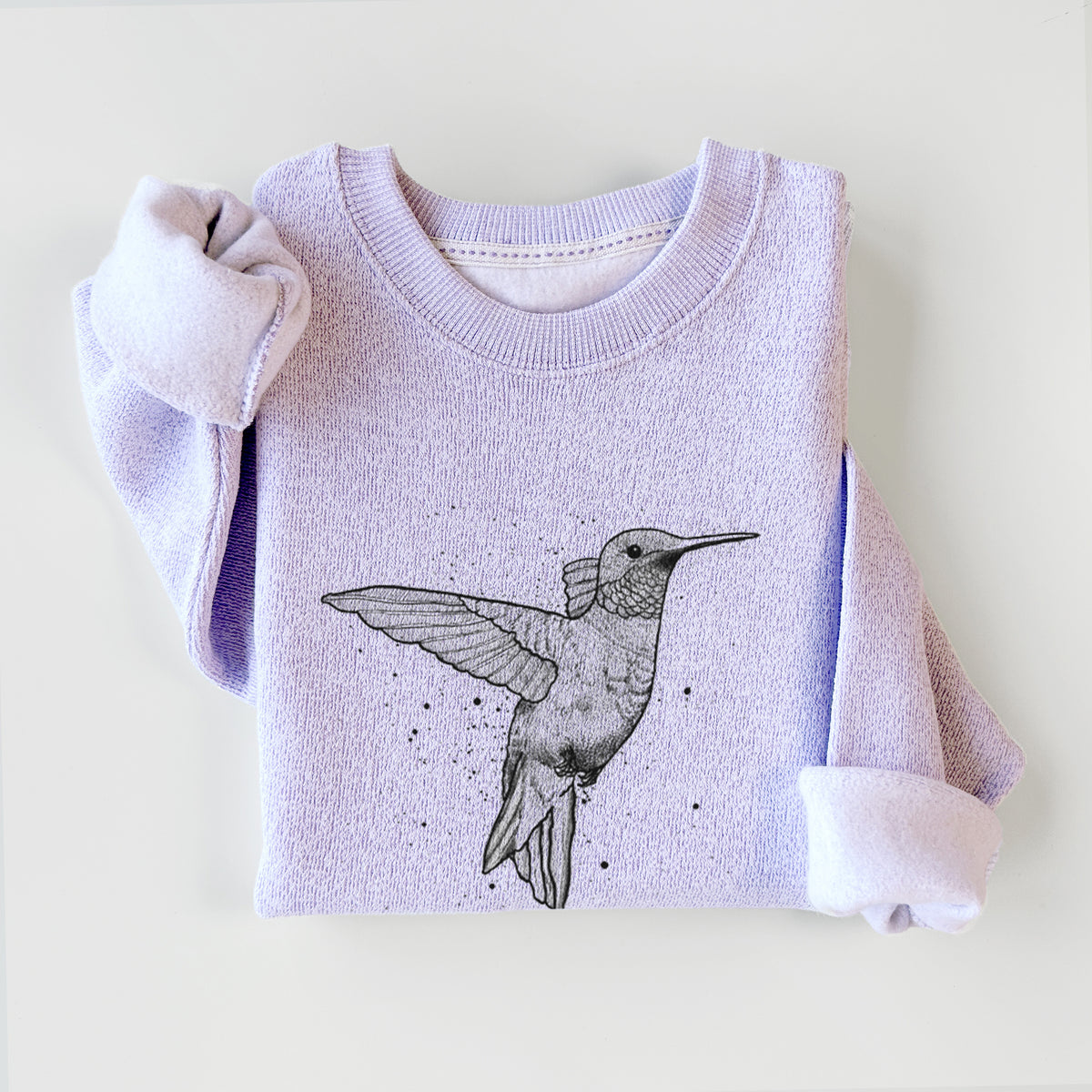 Ice purple knit sweatshirt printed with a black ink sketch of a ruby-throated hummingbird hovering with its wings raised, styled flat.