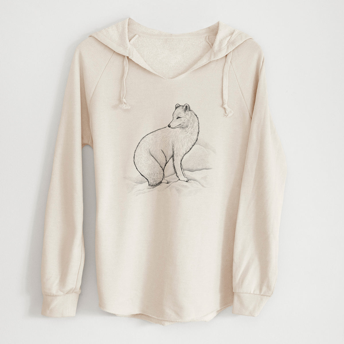 Bone cream women's Cali Wave hooded sweatshirt laid flat, printed with a black ink illustration of an arctic fox sitting in the snow.