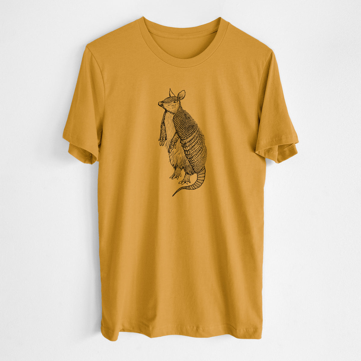 Honeycomb yellow lightweight cotton t-shirt laid flat, printed with a black ink illustration of a nine-banded armadillo standing upright.