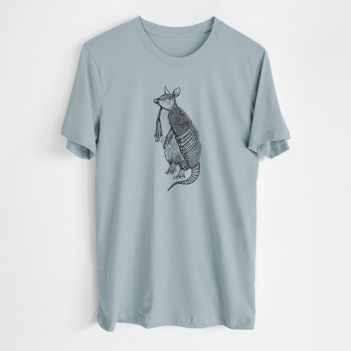 Vintage denim lightweight cotton t-shirt laid flat, printed with a black ink illustration of a nine-banded armadillo standing upright.
