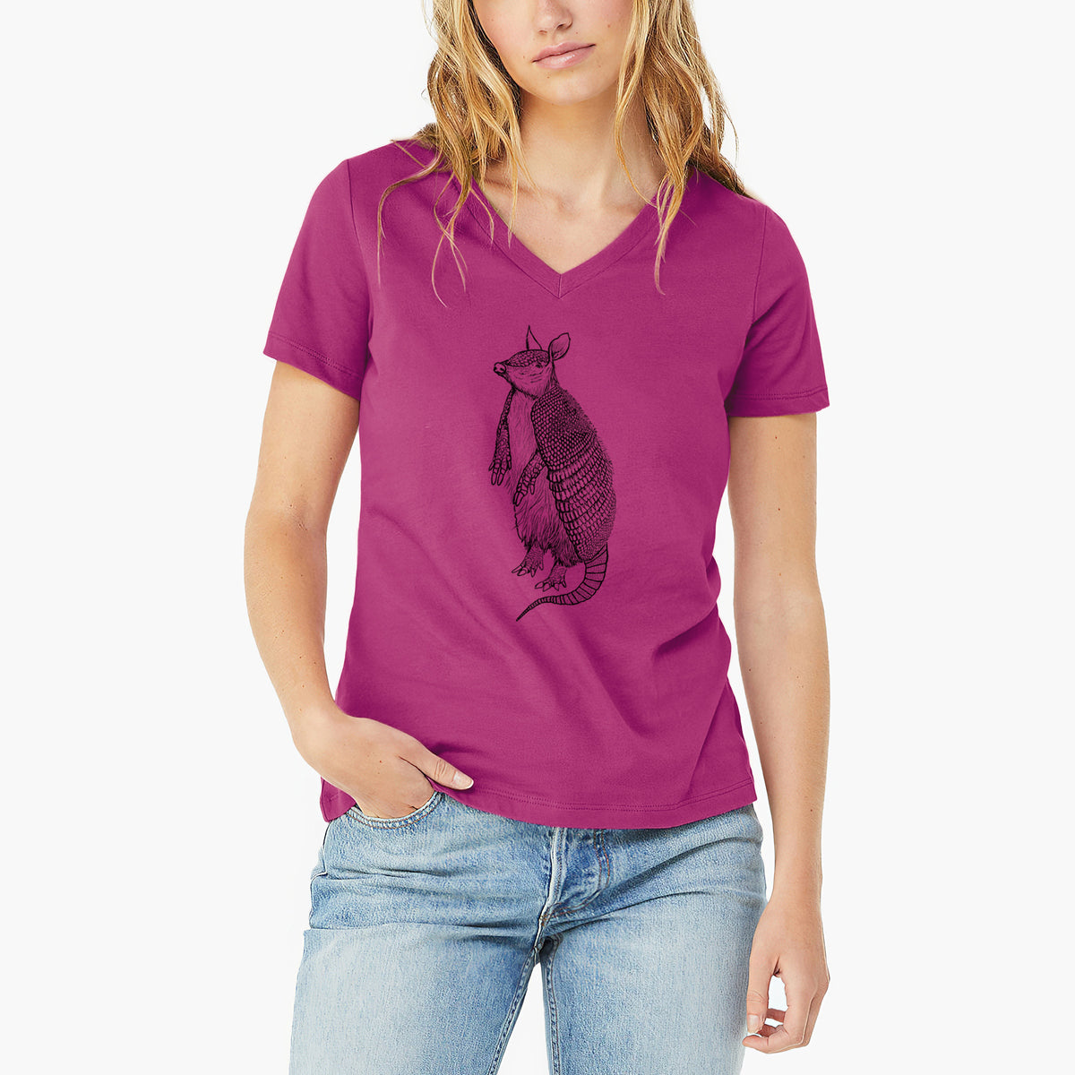 Woman wearing a berry pink women's relaxed fit cotton V-neck t-shirt printed with a black ink illustration of a nine-banded armadillo standing upright.