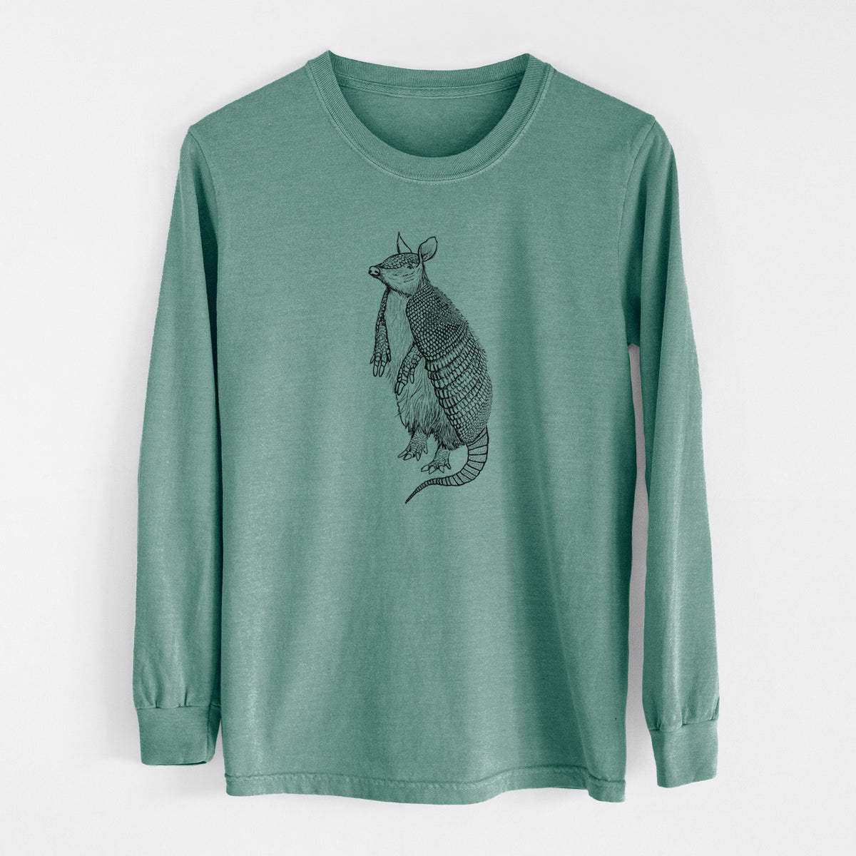 Pine green Comfort Colors long sleeve shirt laid flat, printed with a black ink illustration of a nine-banded armadillo standing upright.