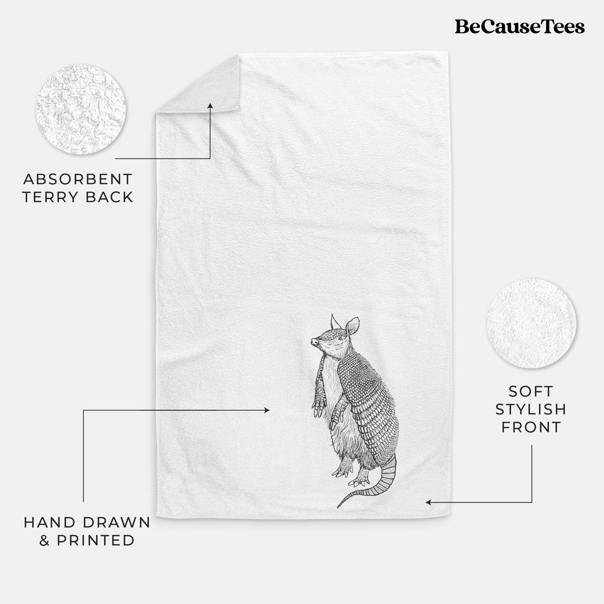 White hand towel printed with a black ink illustration of a nine-banded armadillo standing upright.