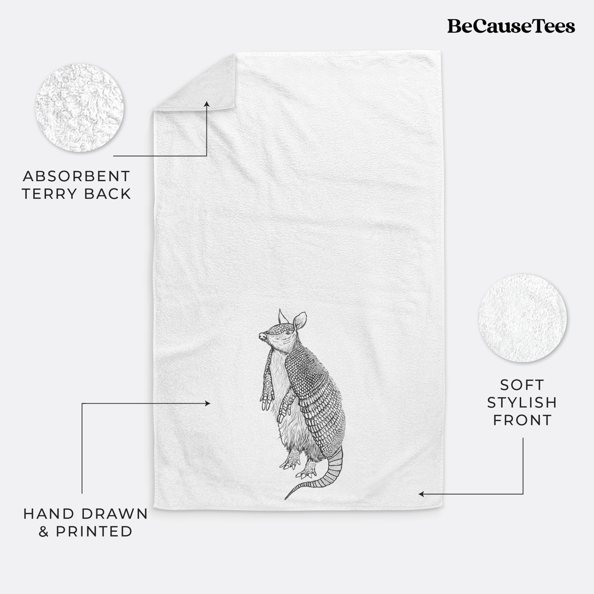 White hand towel printed with a black ink illustration of a nine-banded armadillo standing upright.