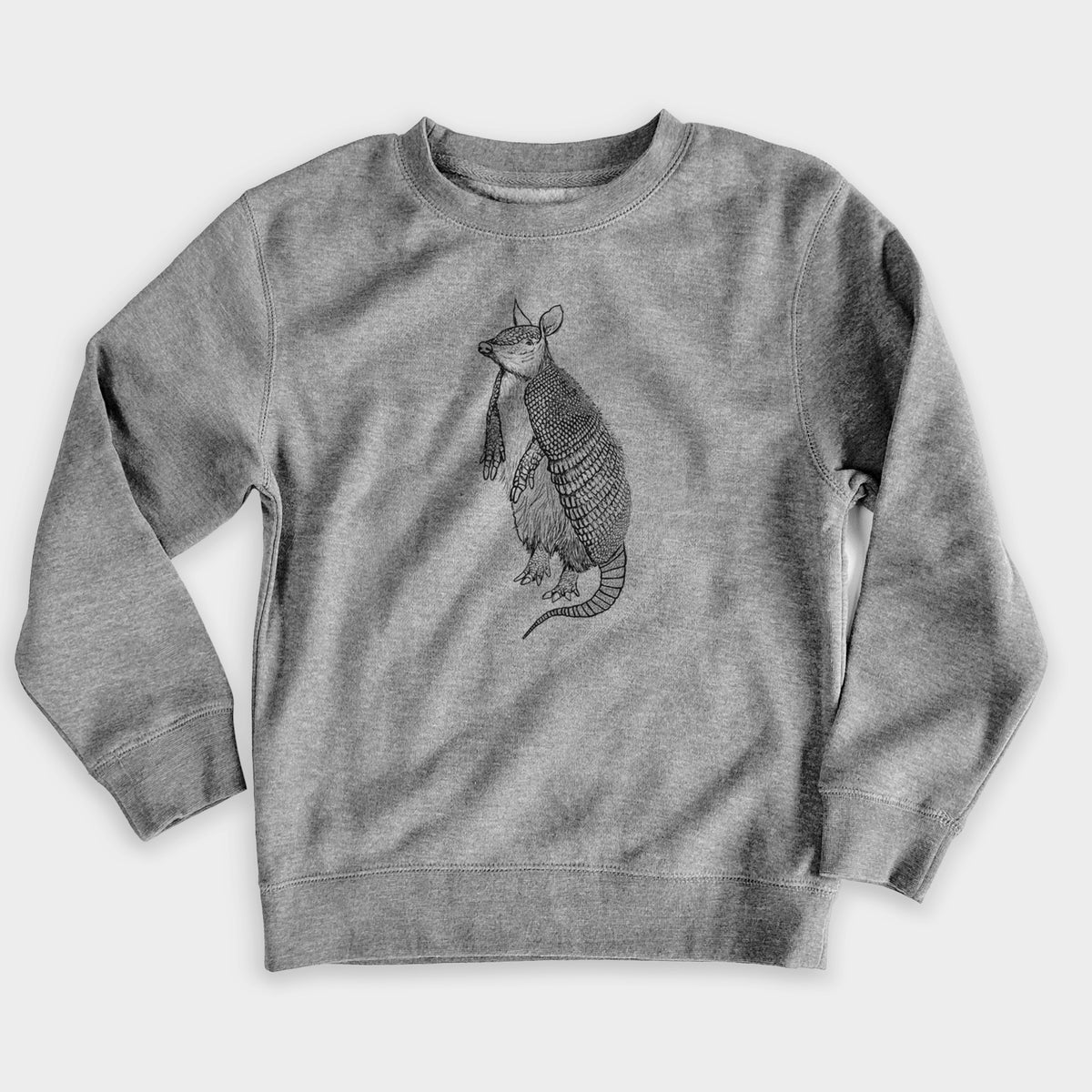 Nickel grey youth crewneck sweatshirt laid flat, printed with a black ink illustration of a nine-banded armadillo standing upright.