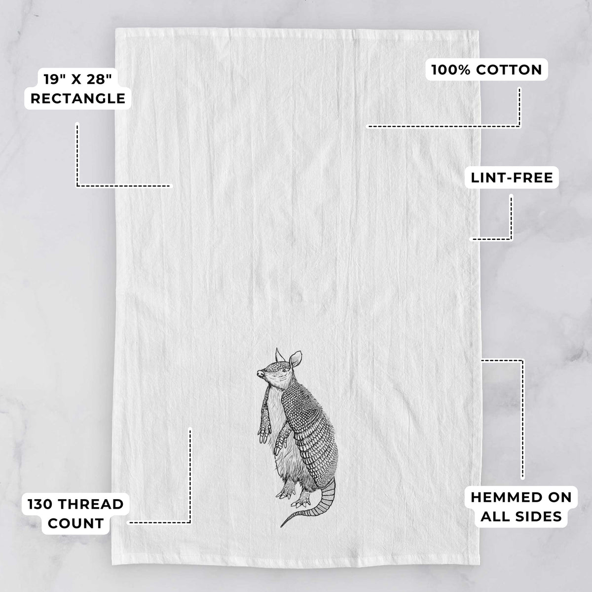 White tea towel printed with a black ink illustration of a nine-banded armadillo standing upright, with feature labels: 19 by 28 inch rectangle, 100% cotton, lint-free, 130 thread count, hemmed on all sides.