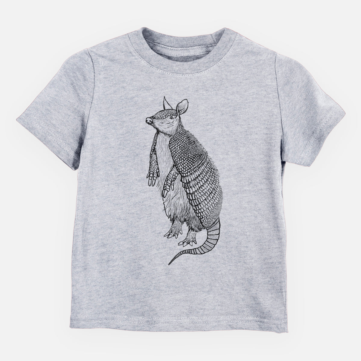 Heather grey toddler t-shirt laid flat, printed with a black ink illustration of a nine-banded armadillo standing upright.