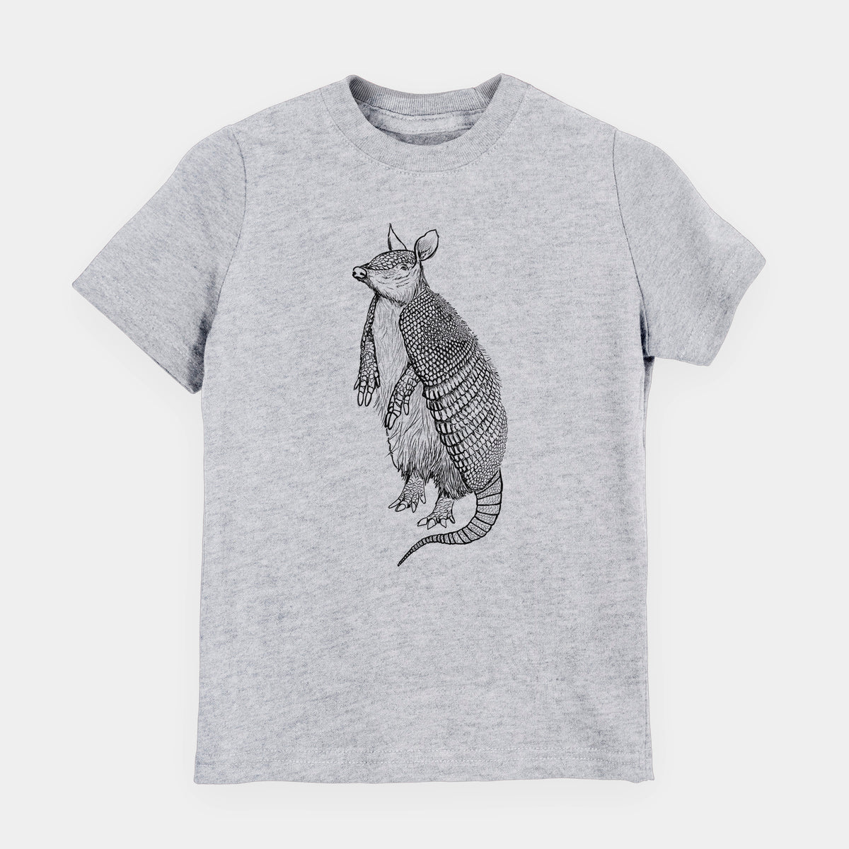 Heather grey youth t-shirt laid flat, printed with a black ink illustration of a nine-banded armadillo standing upright.