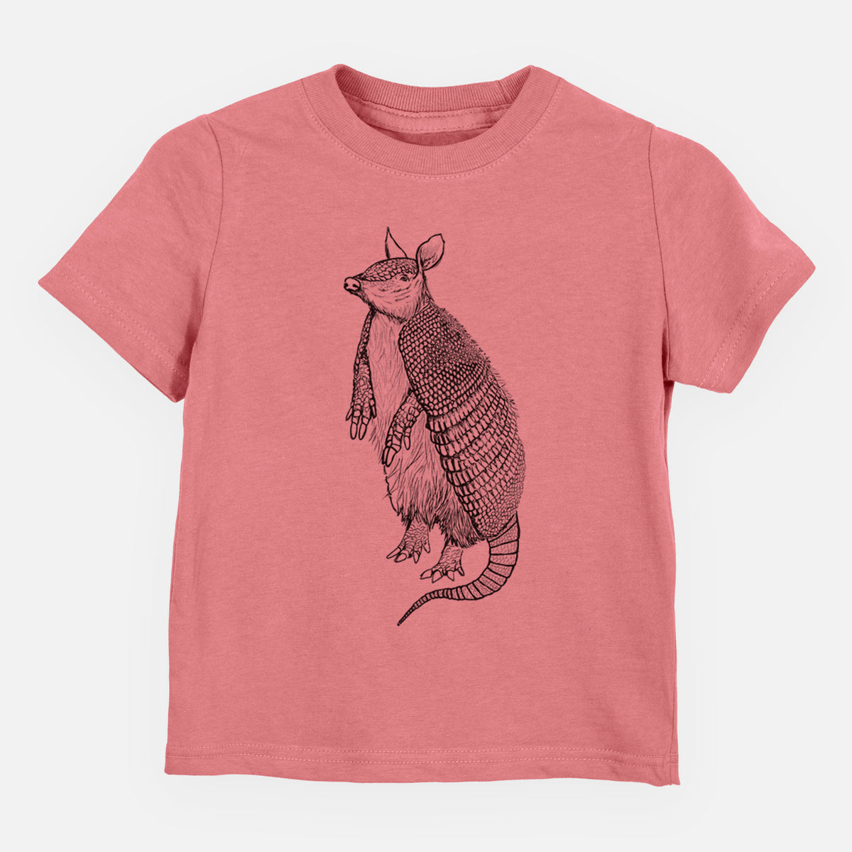 Mauve pink toddler t-shirt laid flat, printed with a black ink illustration of a nine-banded armadillo standing upright.