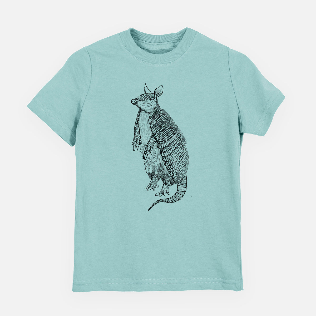 Saltwater youth t-shirt laid flat, printed with a black ink illustration of a nine-banded armadillo standing upright.