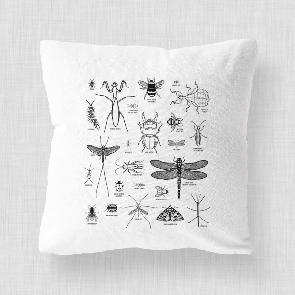 White pillow cover printed with a chart of black ink insect and arthropod illustrations, including dragonflies, beetles, spiders and bees.