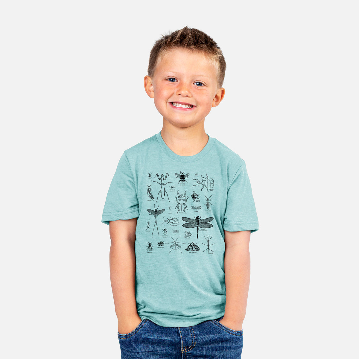 Smiling boy wearing a youth t-shirt printed with a chart of black ink insect and arthropod illustrations, including dragonflies, beetles, spiders and bees.