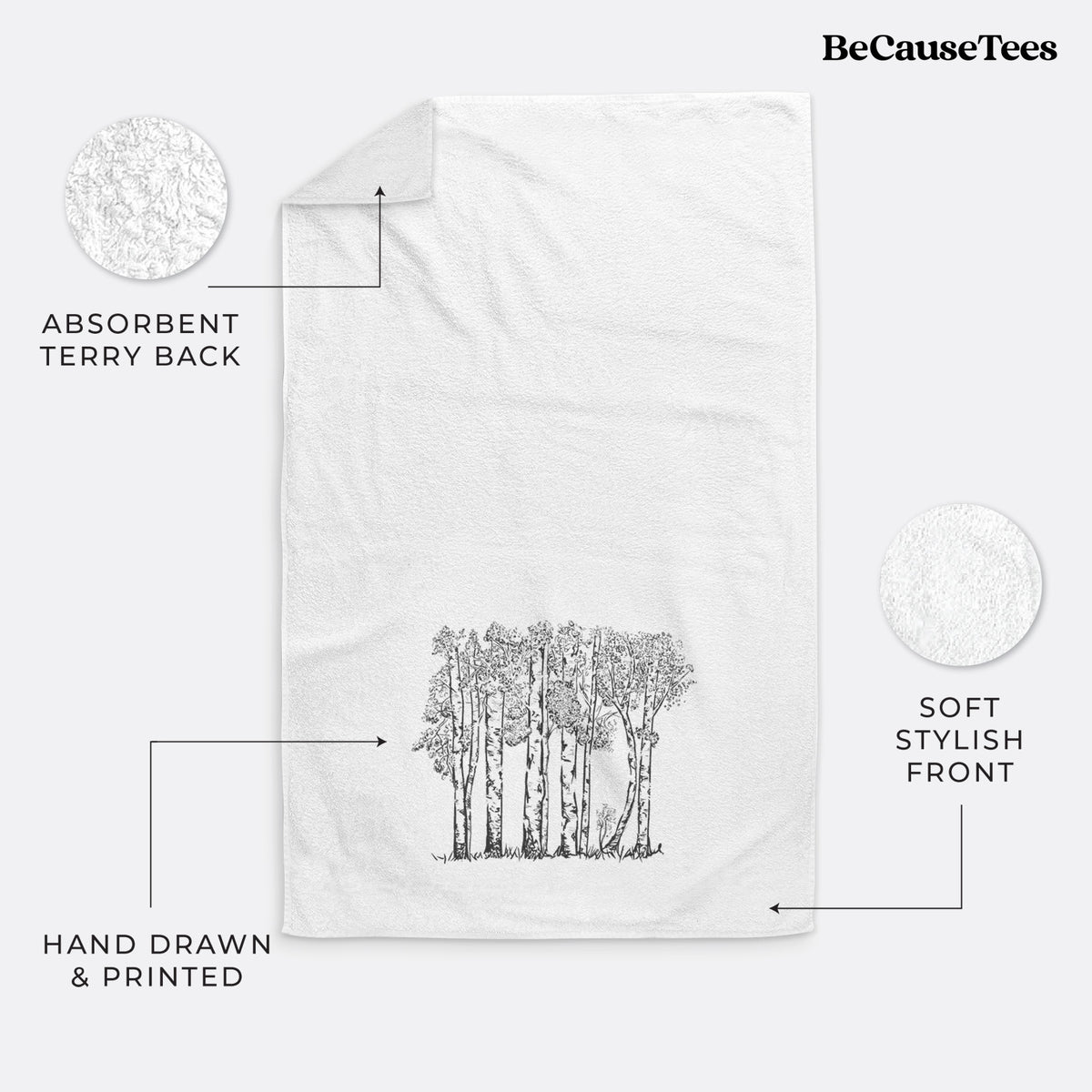 White hand towel printed with a black ink illustration of a grove of aspen trees.