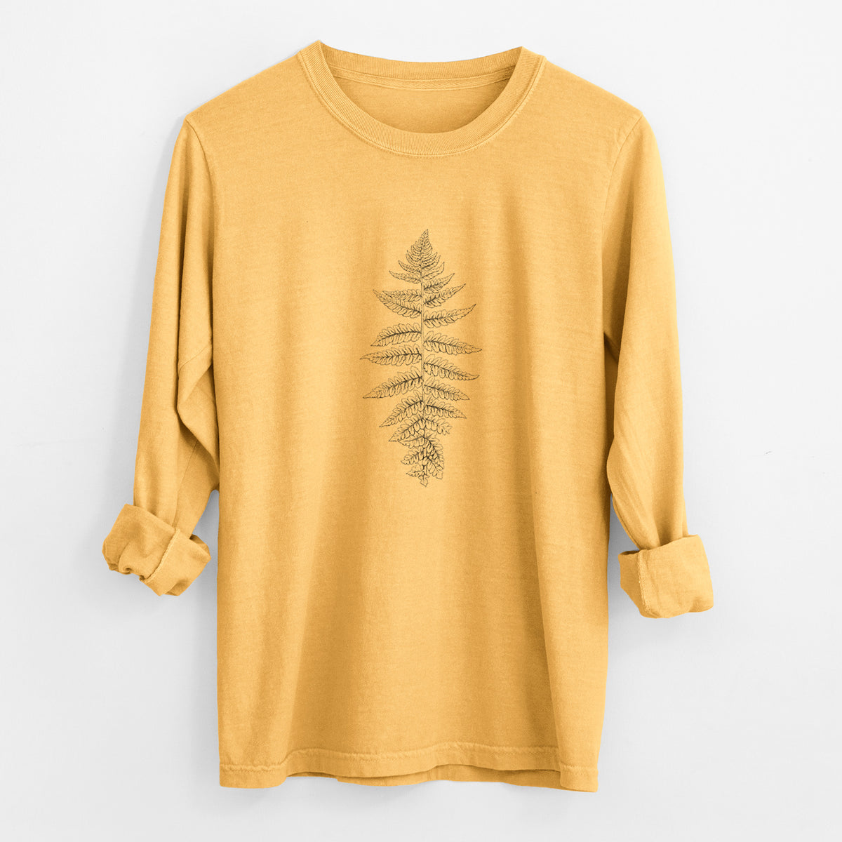 Golden wheat yellow Comfort Colors long sleeve shirt laid flat with the cuffs rolled, printed with a black ink illustration of a lady fern frond.