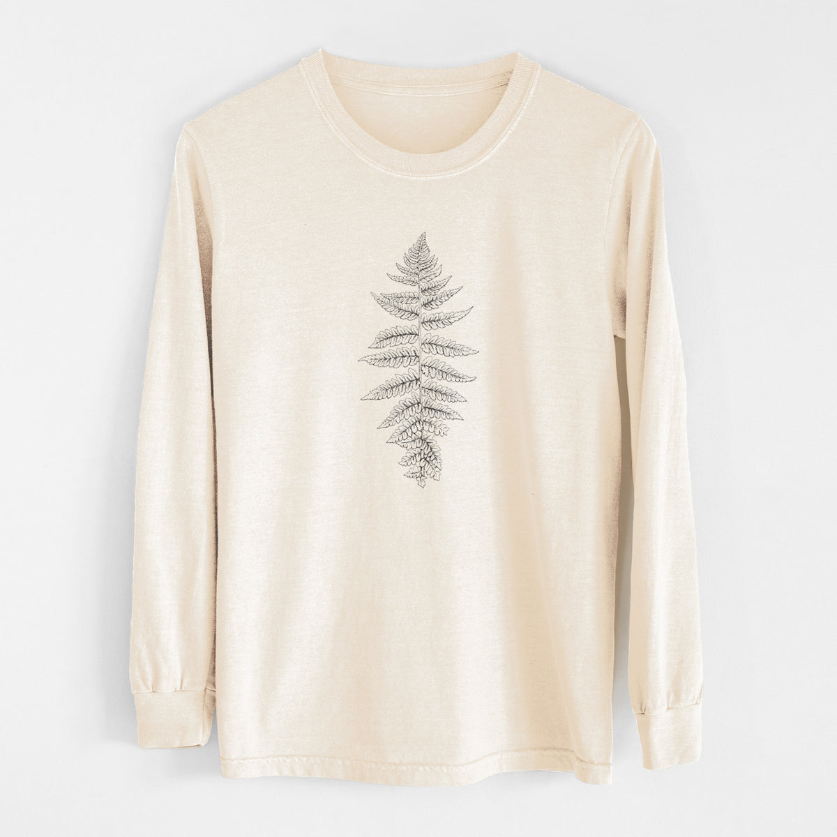 Ivory Comfort Colors long sleeve shirt laid flat, printed with a black ink illustration of a lady fern frond.
